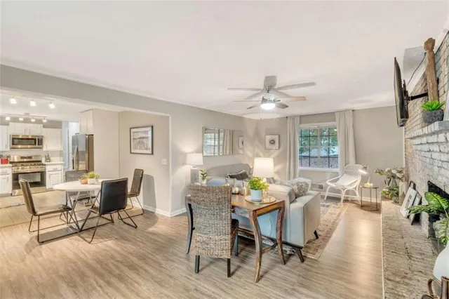a view of a dining room with furniture window and wooden floor