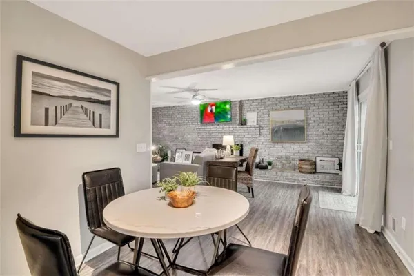 a view of a dining room with furniture and wooden floor