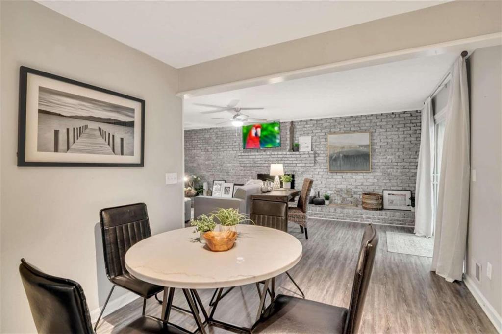 1504 Dupree Road Woodstock, GA 30189 - Photo 6 of 23 a view of a dining room with furniture and wooden floor