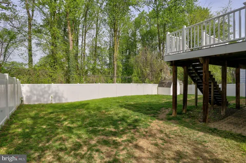 a view of an entrance to house with yard