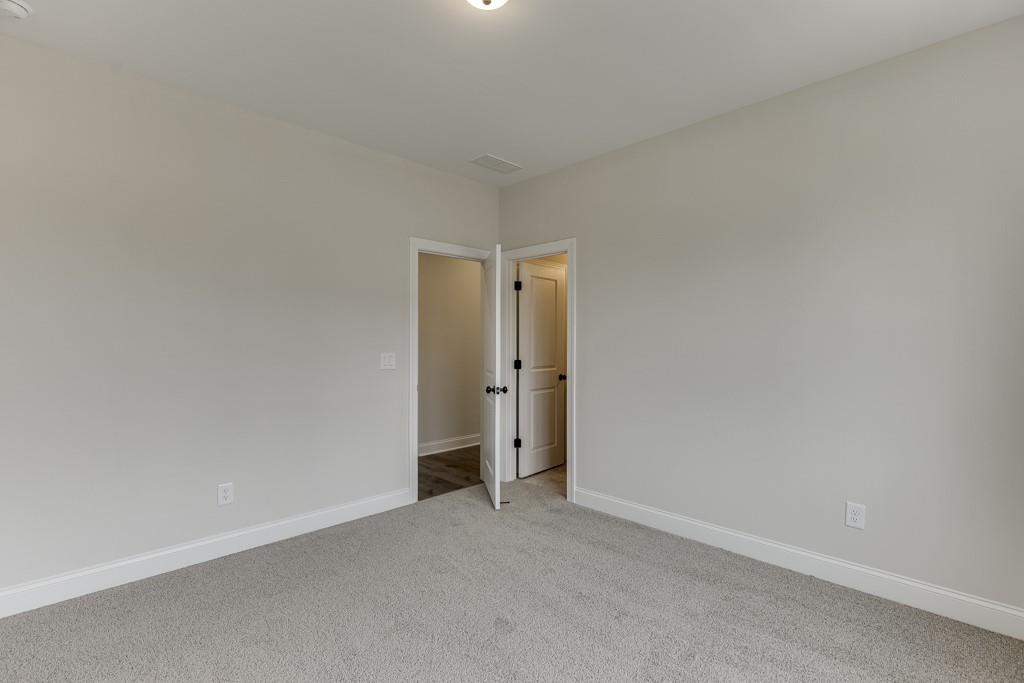 173 Swimming Pool Road Buford, GA 30518 - Photo 34 of 68 a view of an empty room and closet area