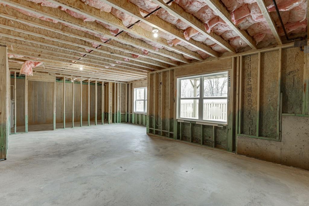 173 Swimming Pool Road Buford, GA 30518 - Photo 43 of 68 a view of an empty room with windows