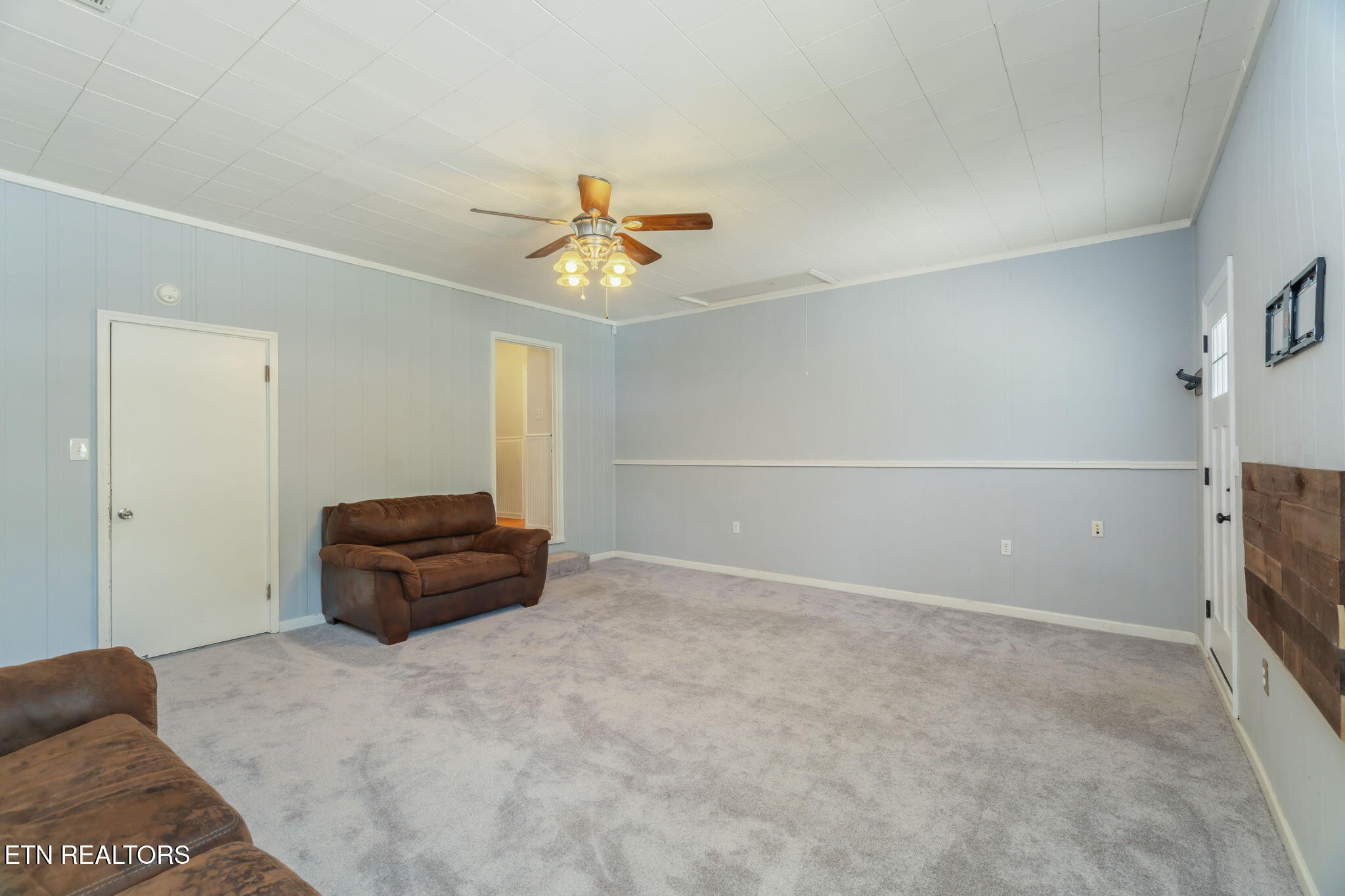 824 Noragate Road Knoxville, TN 37919 - Photo 14 of 29 a living room with a couch and a ceiling fan