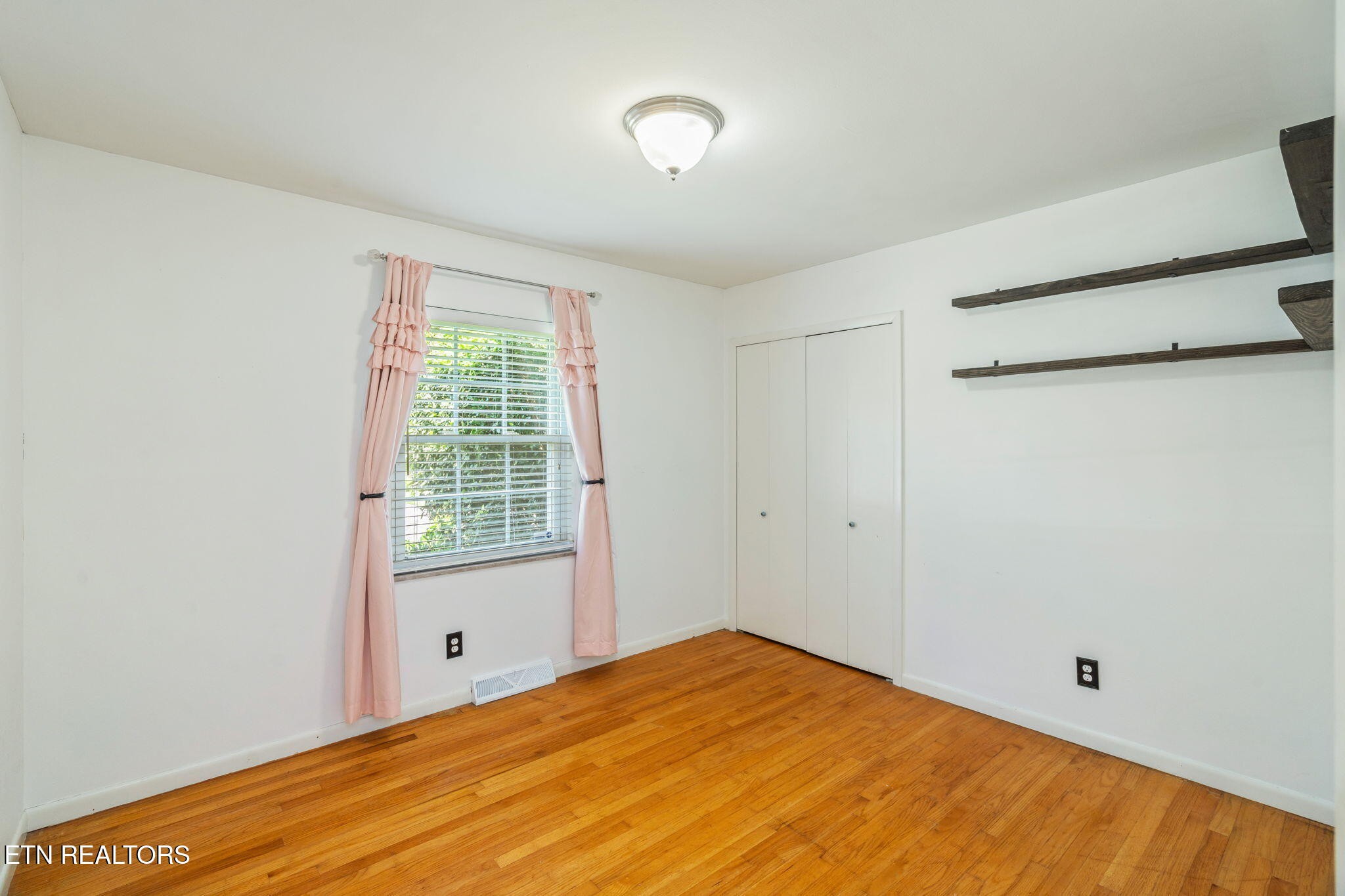 824 Noragate Road Knoxville, TN 37919 - Photo 19 of 29 a view of an empty room with a window