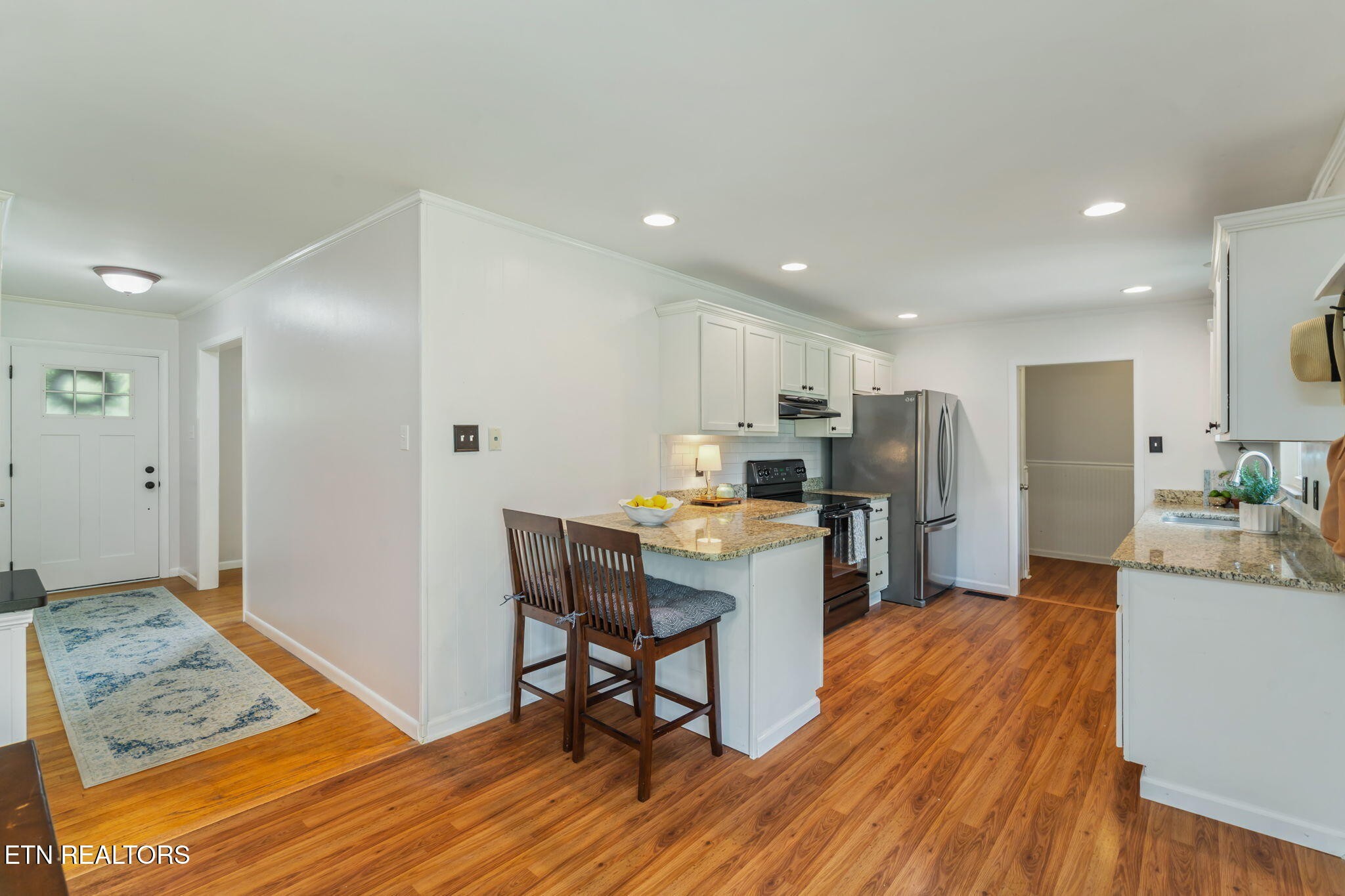 824 Noragate Road Knoxville, TN 37919 - Photo 8 of 29 a view of a dining room with furniture and wooden floor