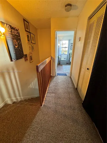a view of a door with wooden floor