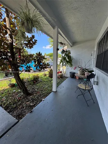 a view of a chairs and tables in the patio