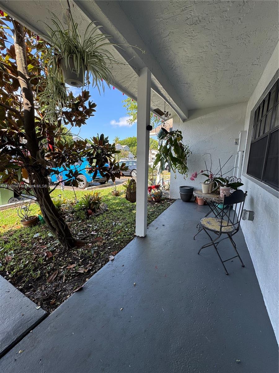 10428 Northwest 3rd Street Pembroke Pines, FL 33026 - Photo 24 of 30 a view of a chairs and tables in the patio
