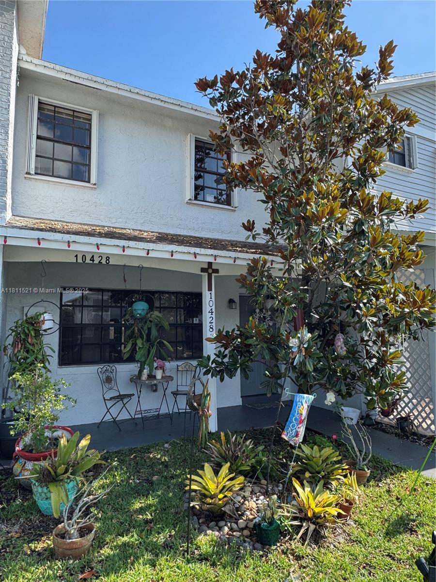 10428 Northwest 3rd Street Pembroke Pines, FL 33026 - Photo 26 of 30 a front view of a house with garden