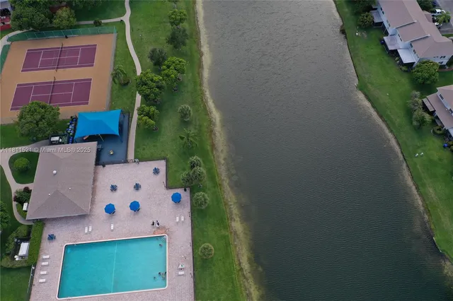 an aerial view of house with yard