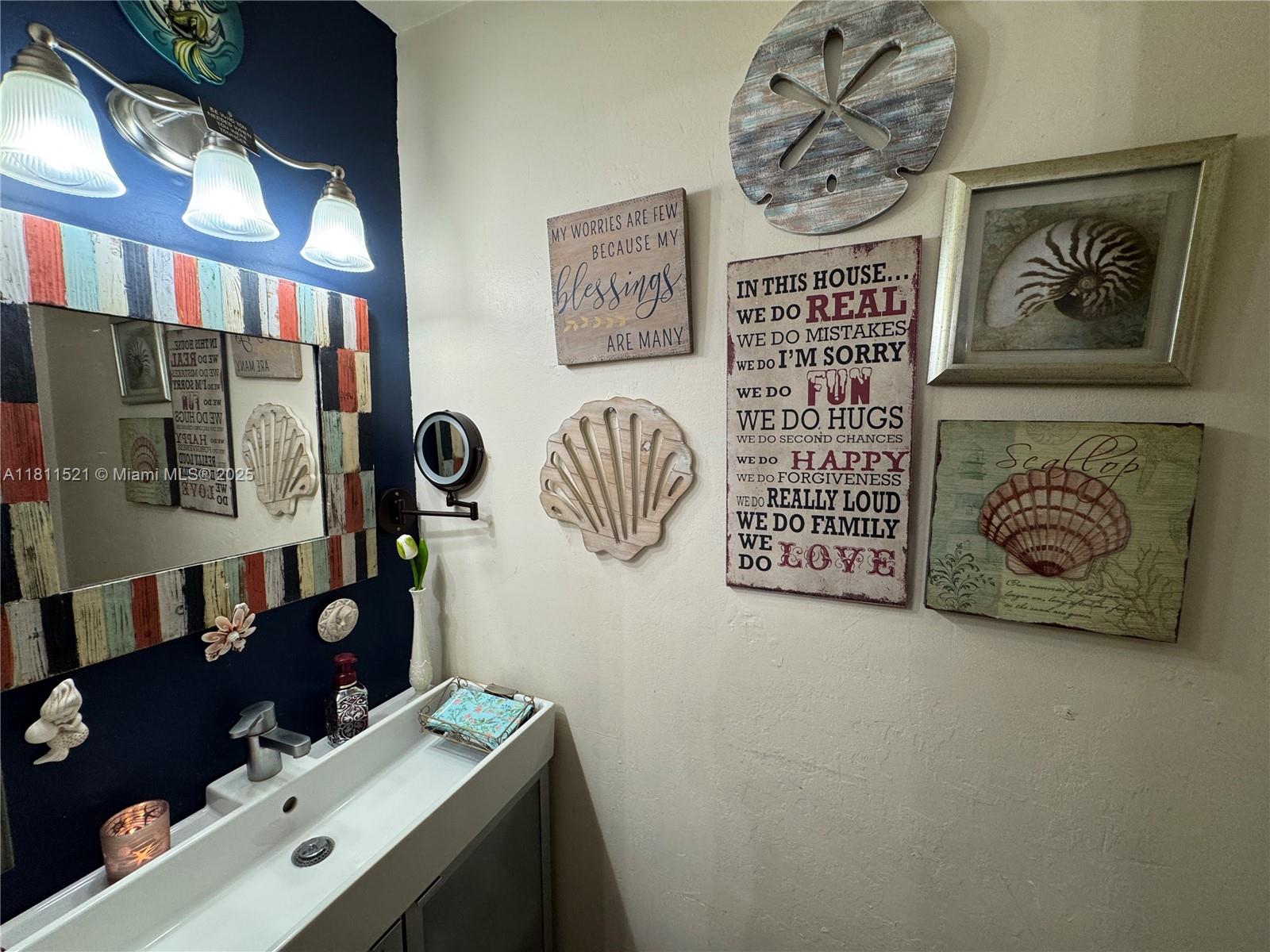 10428 Northwest 3rd Street Pembroke Pines, FL 33026 - Photo 9 of 30 a bathroom with a sink and a mirror