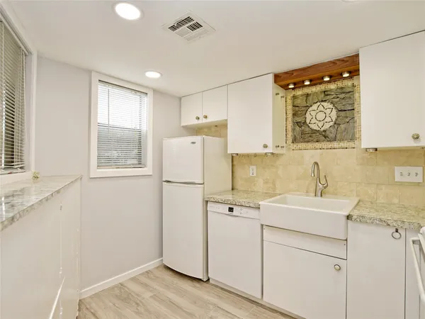 a view of a storage and utility room with a window