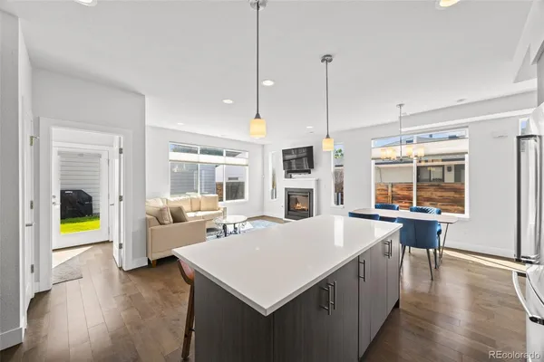 a large white kitchen with a large window