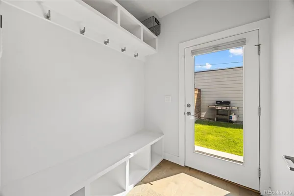 a view of a bedroom with bed and a window