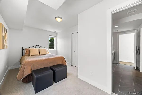a bedroom with a bed and a cabinets