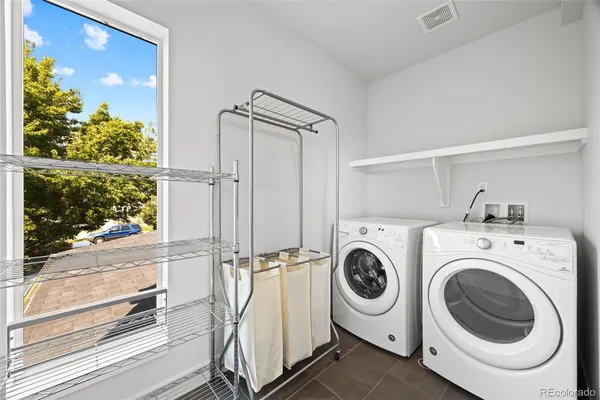 a view of a storage & utility room with washer and dryer