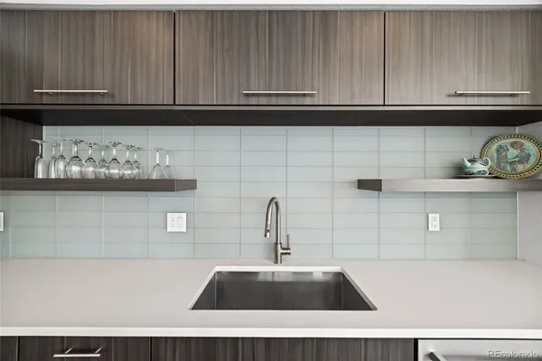 a kitchen with a sink and cabinets