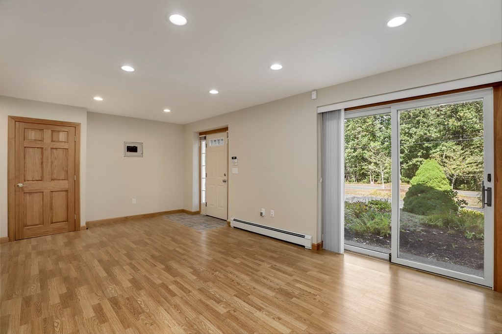 75 Chipaway Road Freetown, MA 02717 - Photo 23 of 34 an empty room with wooden floor and windows