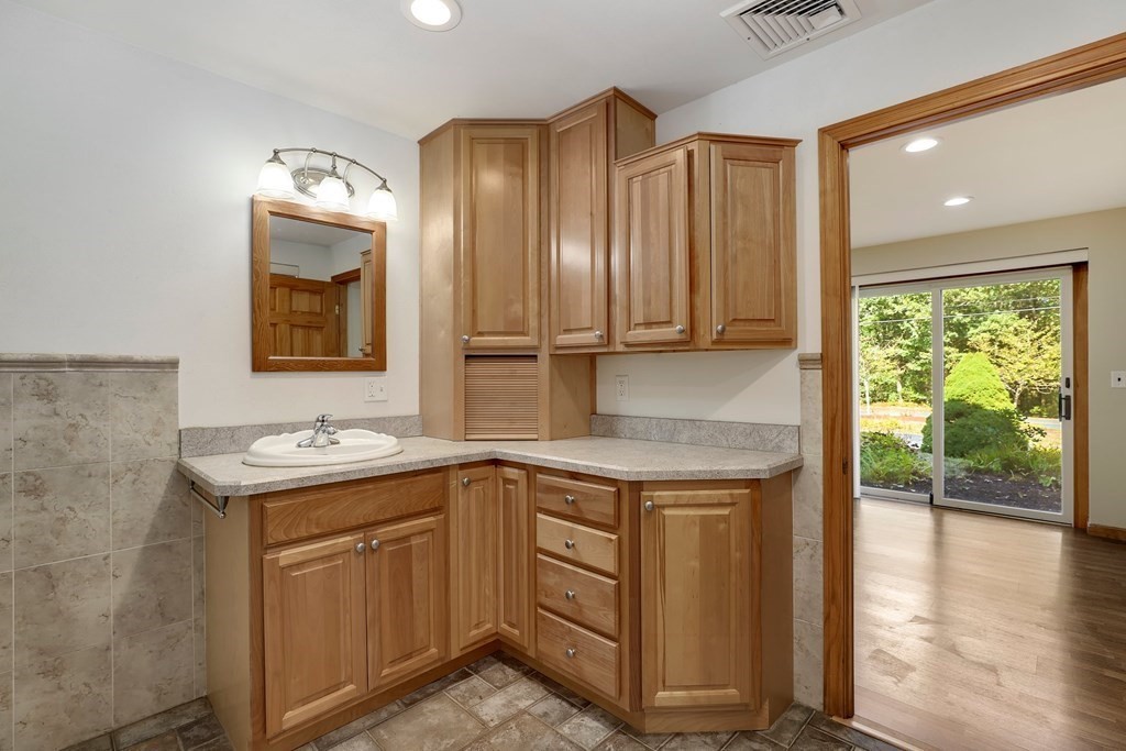 75 Chipaway Road Freetown, MA 02717 - Photo 29 of 34 a kitchen with a sink cabinets and wooden floor