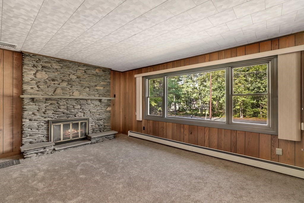 75 Chipaway Road Freetown, MA 02717 - Photo 5 of 34 an empty room with fireplace and window