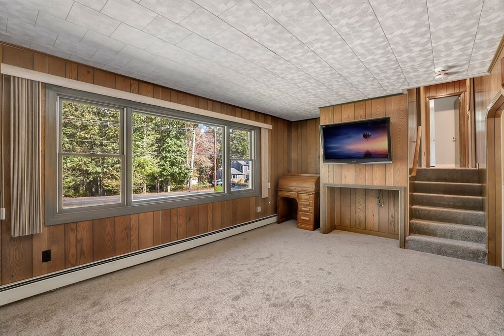 75 Chipaway Road Freetown, MA 02717 - Photo 7 of 34 a view of an empty room with a fireplace and a window