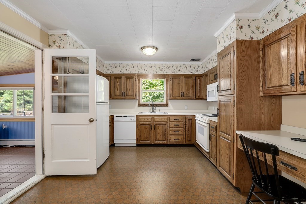 75 Chipaway Road Freetown, MA 02717 - Photo 8 of 34 a kitchen with stainless steel appliances a stove a sink and a refrigerator