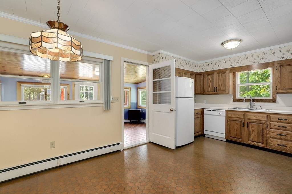 75 Chipaway Road Freetown, MA 02717 - Photo 10 of 34 a kitchen with granite countertop a stove and a refrigerator