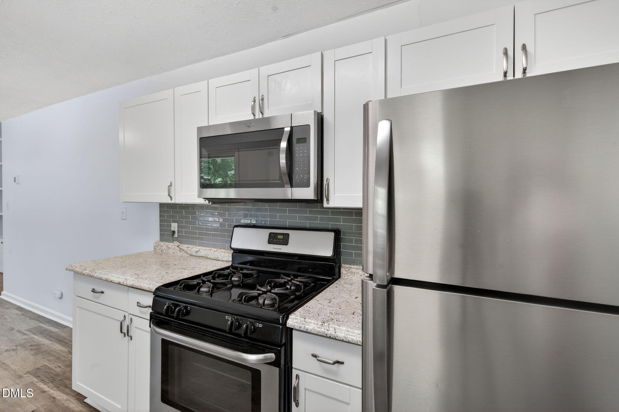 904 Seabrook Road Raleigh, NC 27610 - Photo 7 of 31 a kitchen with stainless steel appliances a refrigerator stove and microwave