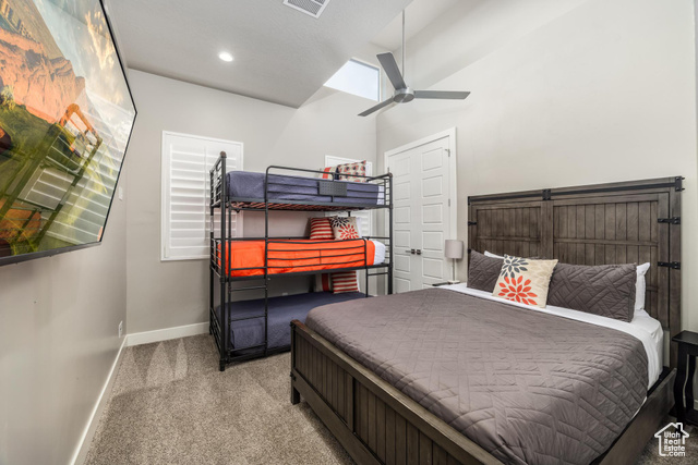 2600 Ocotillo Way, Unit 34 Santa Clara, UT 84765 - Photo 26 of 43 Bedroom featuring carpet flooring, ceiling fan, and lofted ceiling