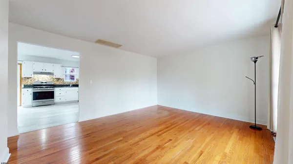 a kitchen with stainless steel appliances granite countertop a refrigerator and a stove