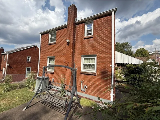 a brick building with a large window