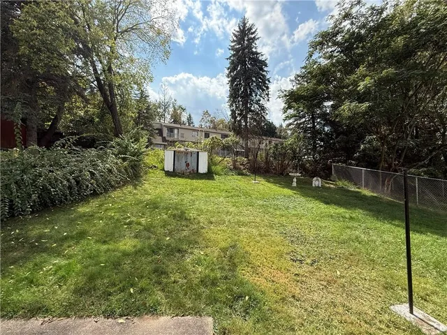 a view of a backyard with sitting area