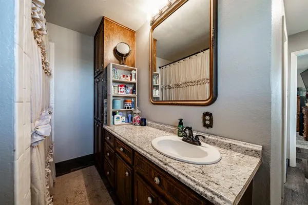a bathroom with a sink and a mirror