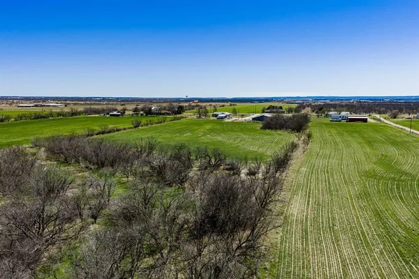 a view of a lake with a yard