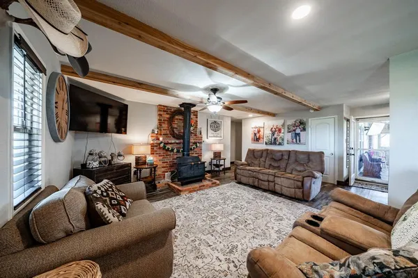 a living room with furniture fireplace and a flat screen tv
