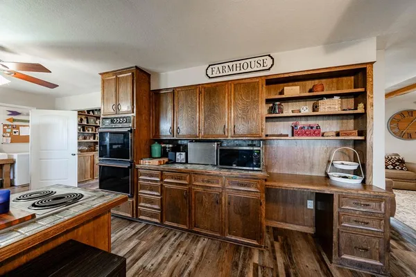 a kitchen with a stove and a refrigerator