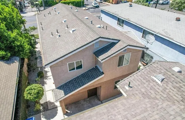 a aerial view of a house with a yard