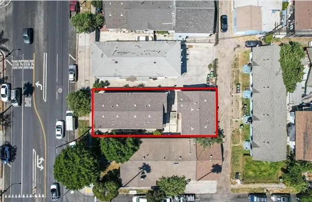 an aerial view of residential houses and outdoor space