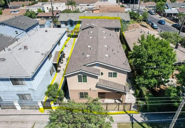 an aerial view of a house with a swimming pool