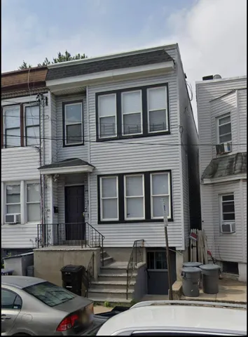 a front view of a house with garage