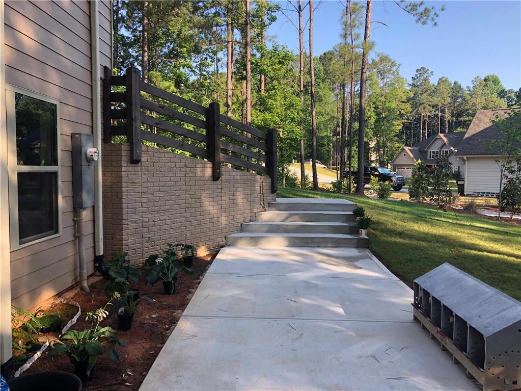 37 Farmstead Way Senoia, GA 30276 - Photo 20 of 96 a front view of a house with a garden