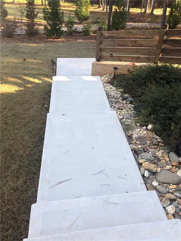 a bedroom with a bed and a mirror on dresser