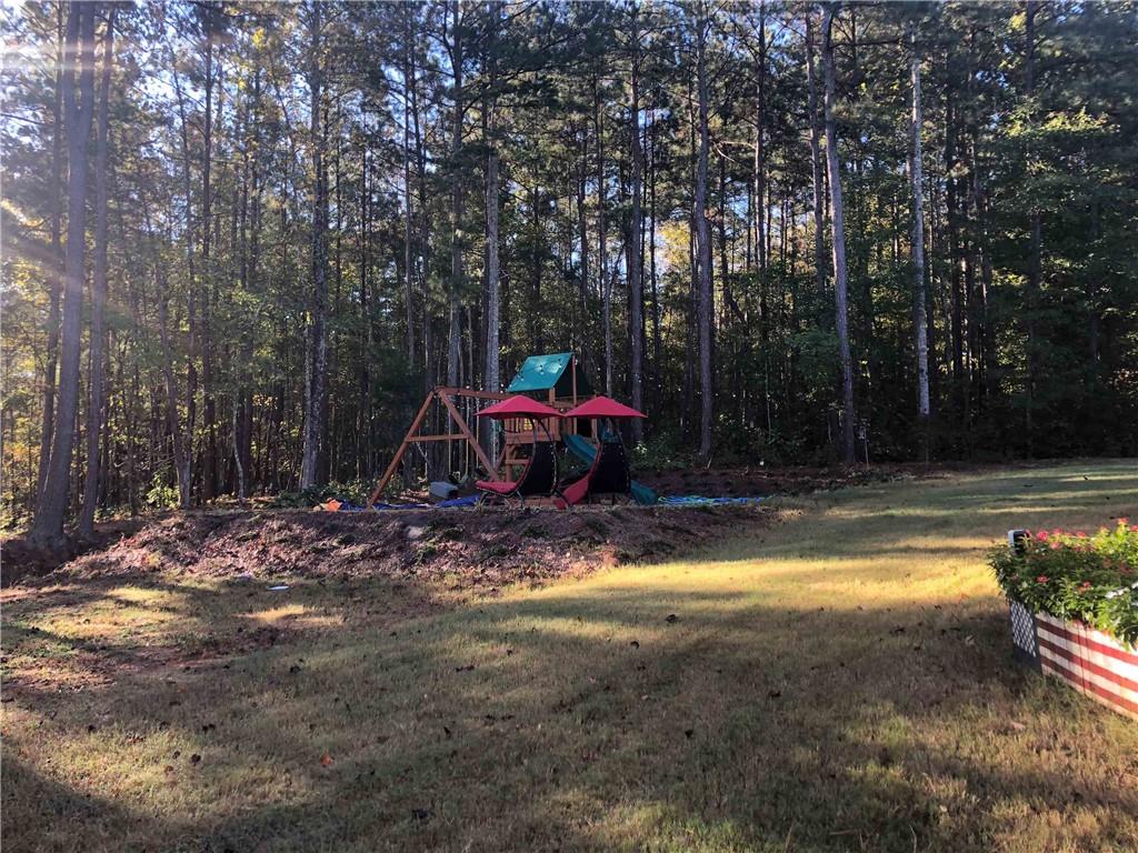 37 Farmstead Way Senoia, GA 30276 - Photo 23 of 96 a view of swimming pool with sitting area and garden