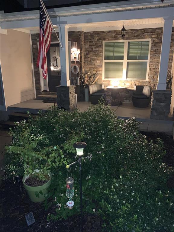 37 Farmstead Way Senoia, GA 30276 - Photo 32 of 96 a front view of a house with outdoor seating