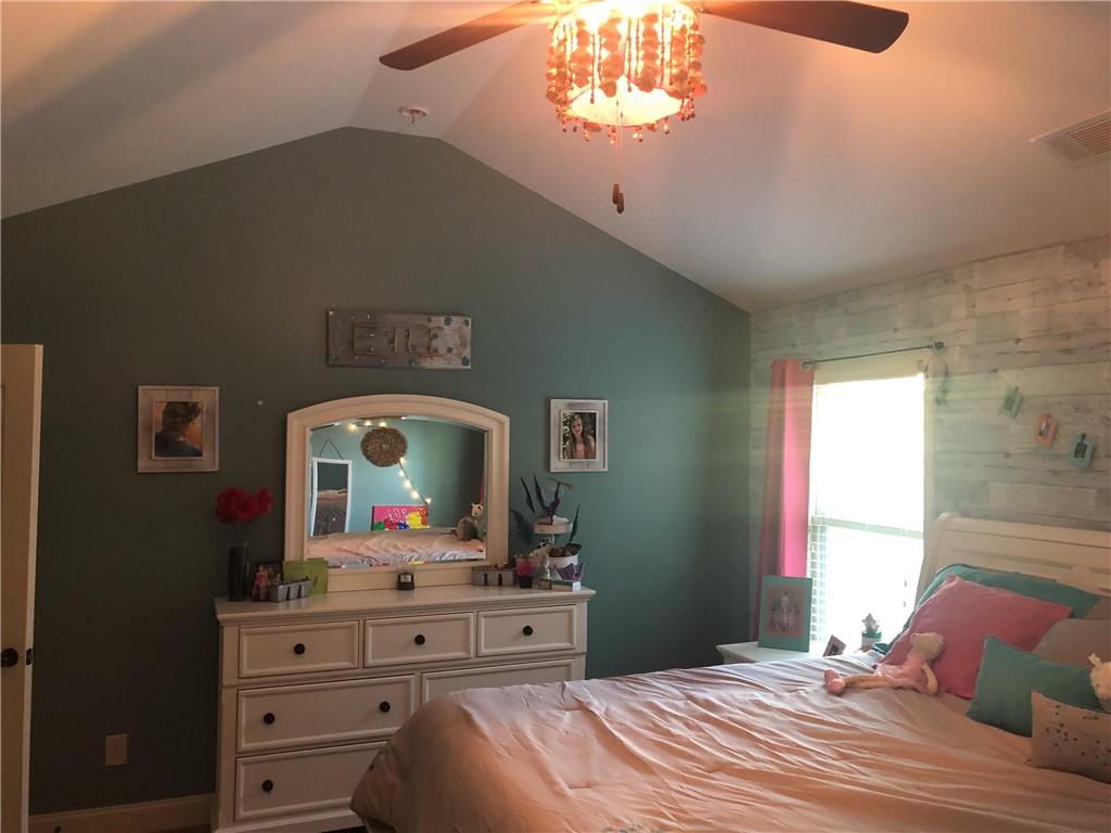 37 Farmstead Way Senoia, GA 30276 - Photo 39 of 96 a bedroom with a bed and a mirror on dresser