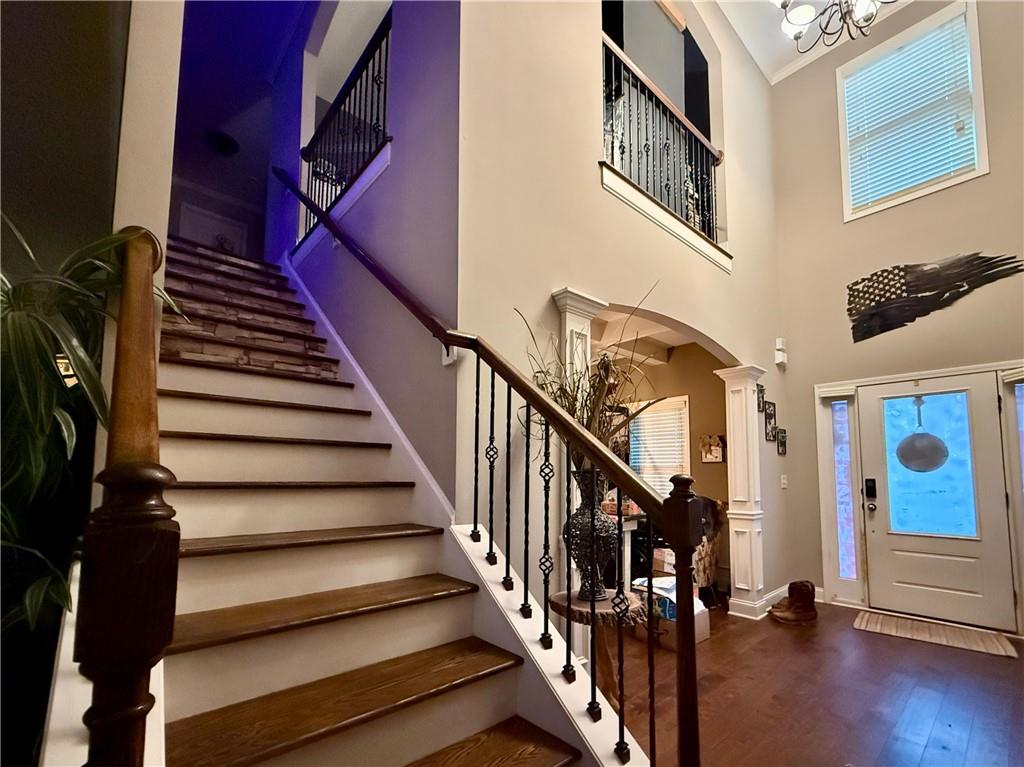 37 Farmstead Way Senoia, GA 30276 - Photo 44 of 96 a view of staircase with lots of frames on wall and wooden floor