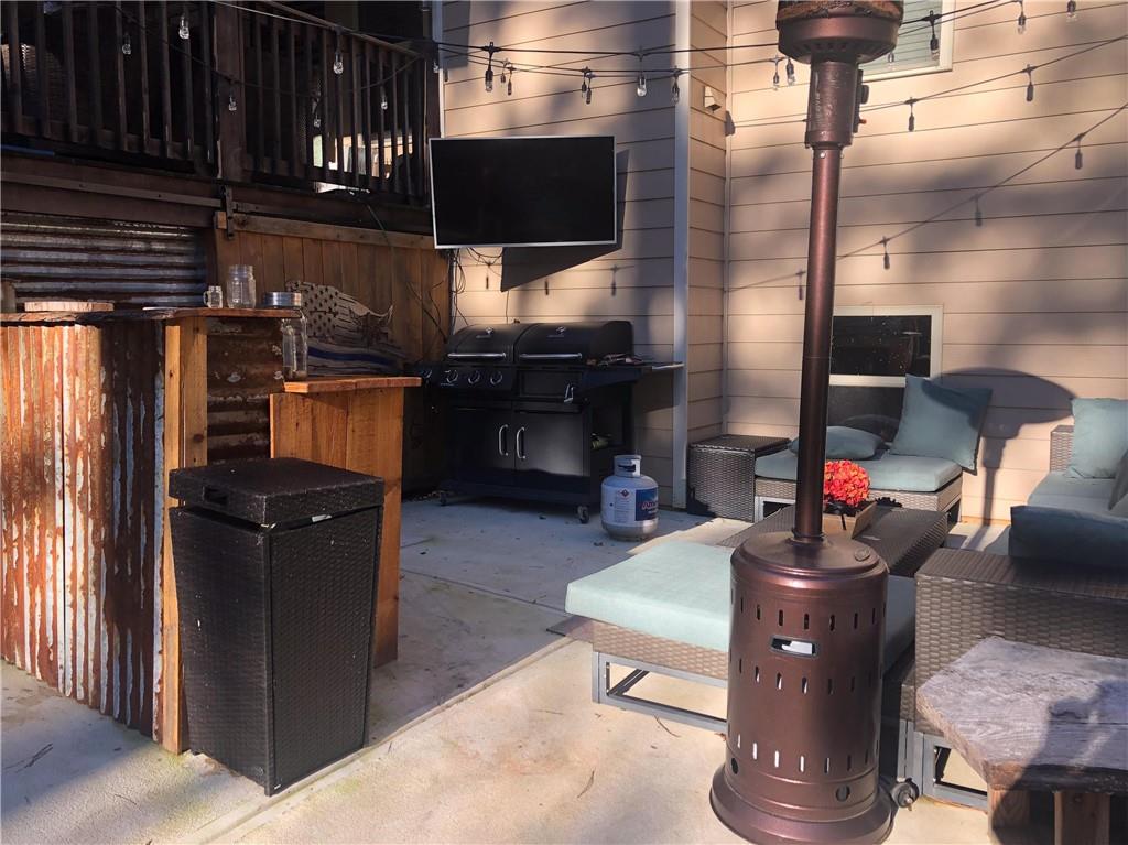37 Farmstead Way Senoia, GA 30276 - Photo 5 of 96 a living room with couch chairs and a fireplace