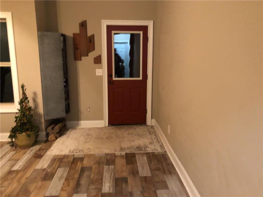 37 Farmstead Way Senoia, GA 30276 - Photo 78 of 96 a view of a hallway with wooden floor and a bathroom