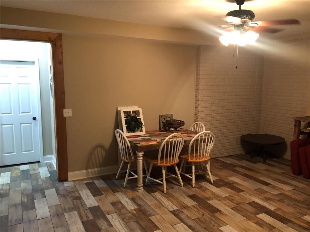 37 Farmstead Way Senoia, GA 30276 - Photo 79 of 96 a dining room with furniture and wooden floor