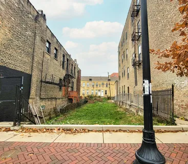 a view of a street with a building in the background